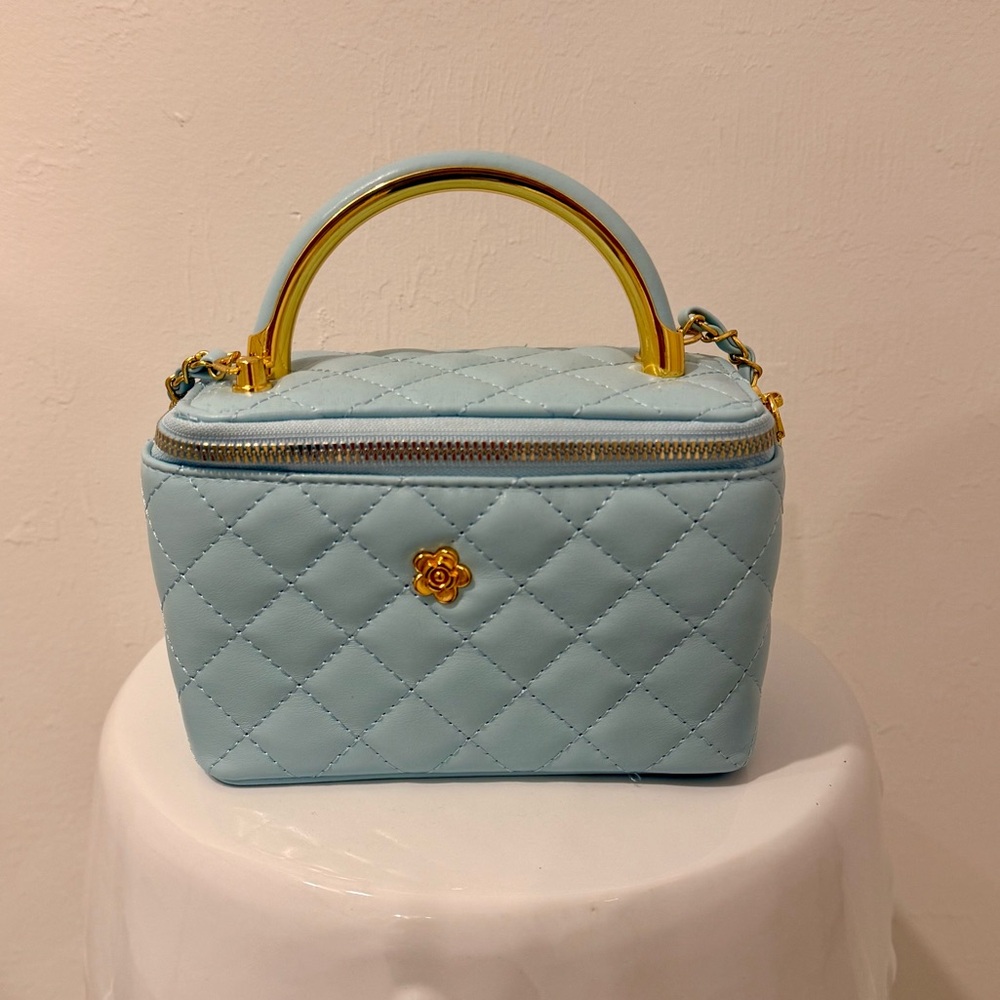 Elegant Blue Quilted Handbag with Gold Details